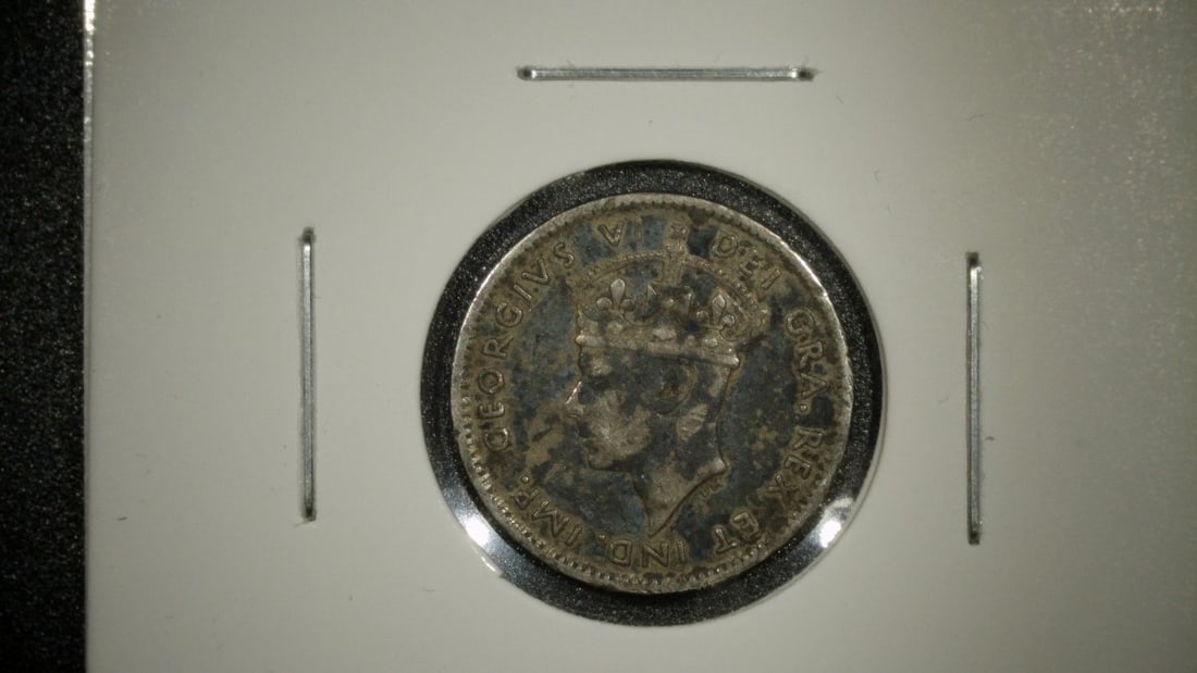 1945-C Newfoundland 10 Cents Silver Coin Extra Fine by Thomas Humphrey Paget: **Important** Please read below description on how to avoid high shipping costs. This is a stunning 1945-C Newfoundland 10 Cents coin, struck in the final years before Newfoundland joined the Canadian