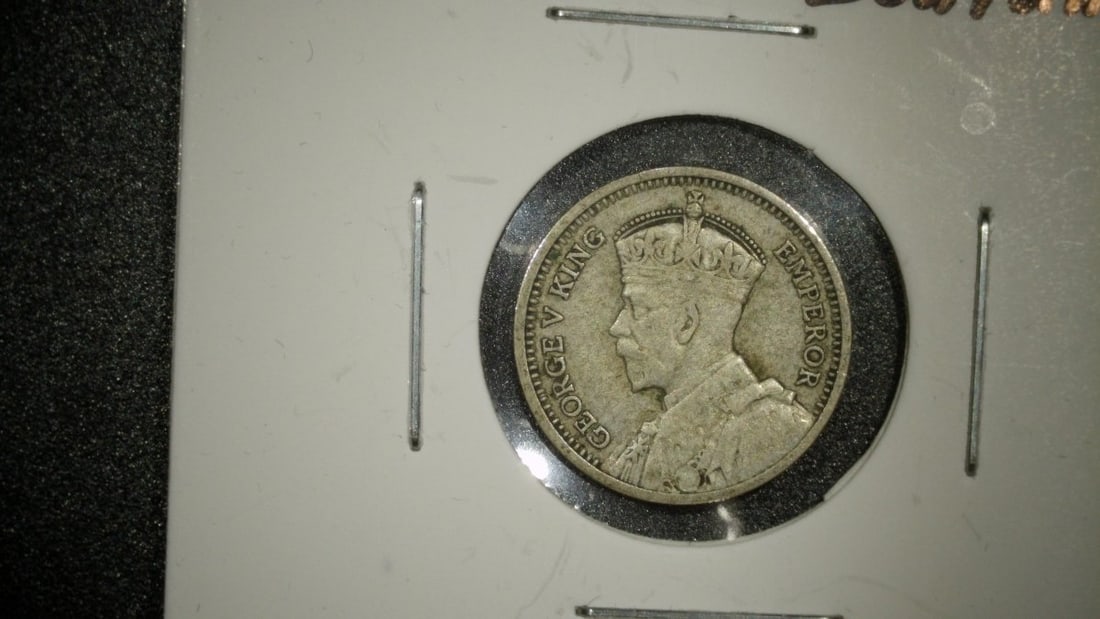 1933 New Zealand 3 Pence Silver Coin VF King George V George Kruger Gray Art: **Important** Please read below description on how to avoid high shipping costs. This is a lot of two 1933 New Zealand 3 Pence silver coins, both in Very Fine (VF) condition. The obverse features the