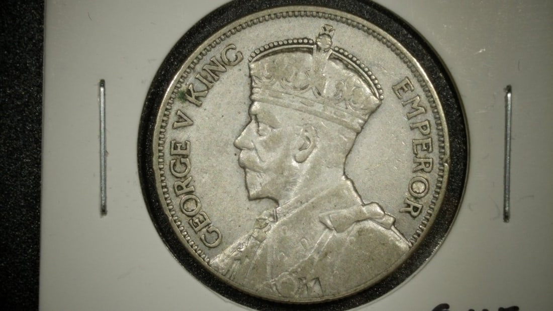 1934 New Zealand One Florin Silver Coin George V VF Grade: **Important** Please read below description on how to avoid high shipping costs. Up for auction is a 1934 New Zealand One Florin, professionally graded as Very Fine (VF). This stunning coin is