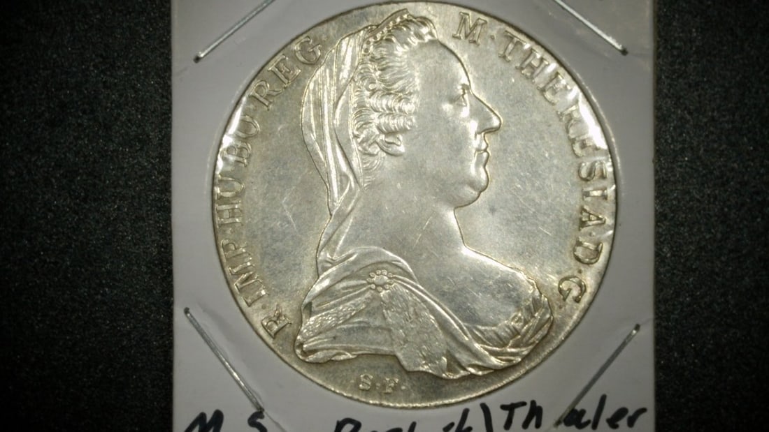 1780-SF Austria Maria Theresa Thaler Restrike Mint State Silver Coin: **Important** Please read below description on how to avoid high shipping costs. This exquisite 1780-SF Maria Theresa Thaler from Austria is a restrike, minted after 1780, which was a common practice