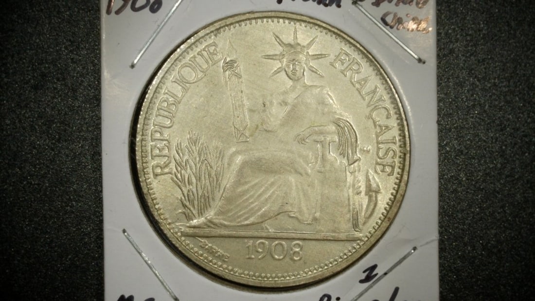 1908-A French Indochina Silver Piastre de Commerce by Jean-Auguste Barre MS: **Important** Please read below description on how to avoid high shipping costs. Bid on this exquisite 1908 French Indochina Piastre de Commerce, struck at the Paris Mint (mint mark 'A'). This