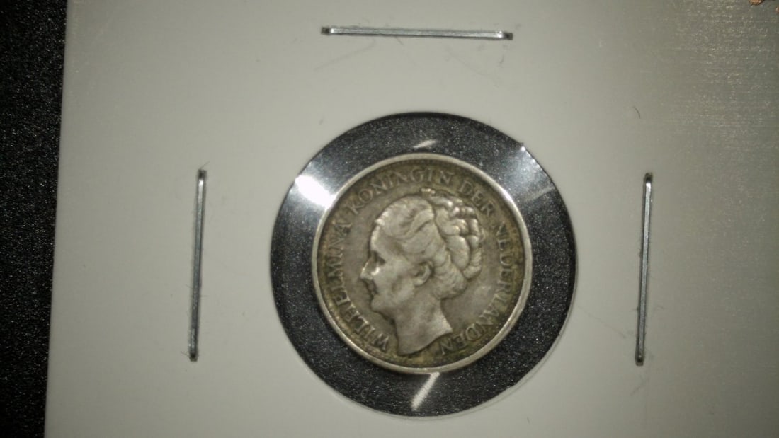 1943 Netherlands 10 Cents Silver Coin Queen Wilhelmina Extra Fine Premium Collectible: **Important** Please read below description on how to avoid high shipping costs. Discover a remarkable piece of history with this 1943 Netherlands 10 Cents silver coin featuring the iconic portrait of