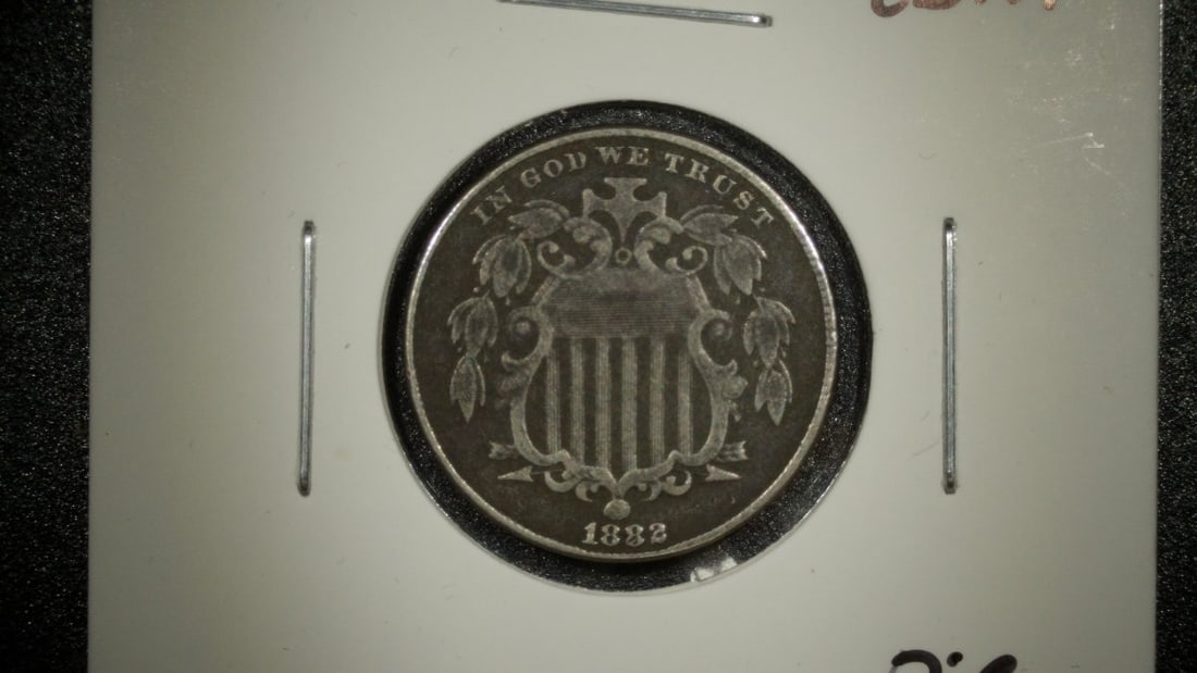 1882 U.S. Shield Nickel 5 Cent Coin Extra Fine XF by James B. Longacre: **Important** Please read below description on how to avoid high shipping costs. This is an 1882 Shield Nickel in Extra Fine condition. The obverse features a shield design with the motto 'IN GOD WE T