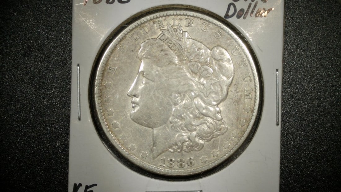 1886-P Morgan Silver Dollar Coin Very Fine 90% Silver United States Mint: **Important** Please read below description on how to avoid high shipping costs. Discover a remarkable piece of U.S. history with this 1886-P Morgan Silver Dollar, graded Very Fine. This iconic coin, 
