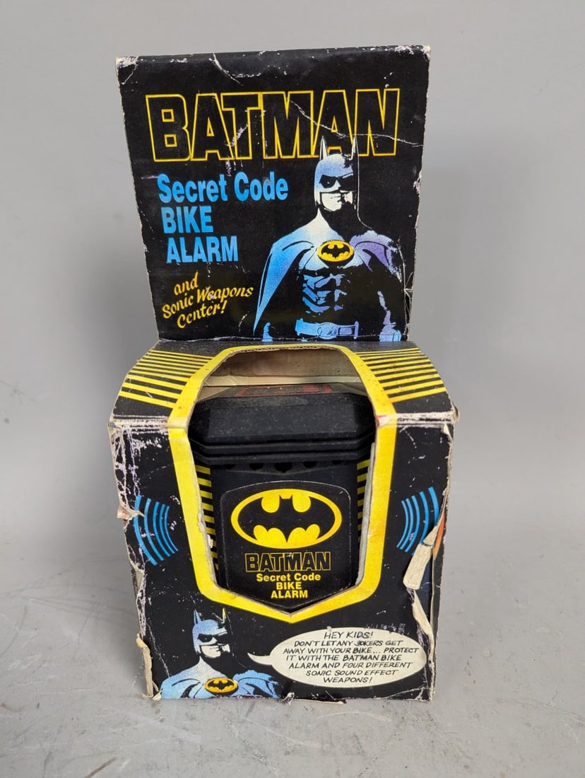 1989 Batman Secret Code Bike Alarm and Sonic Weapons Center DC Comics Collectible: **Important** Please read below description on how to avoid high shipping costs. Introducing the 1989 Batman Secret Code Bike Alarm and Sonic Weapons Center! This exciting piece of New Old Stock