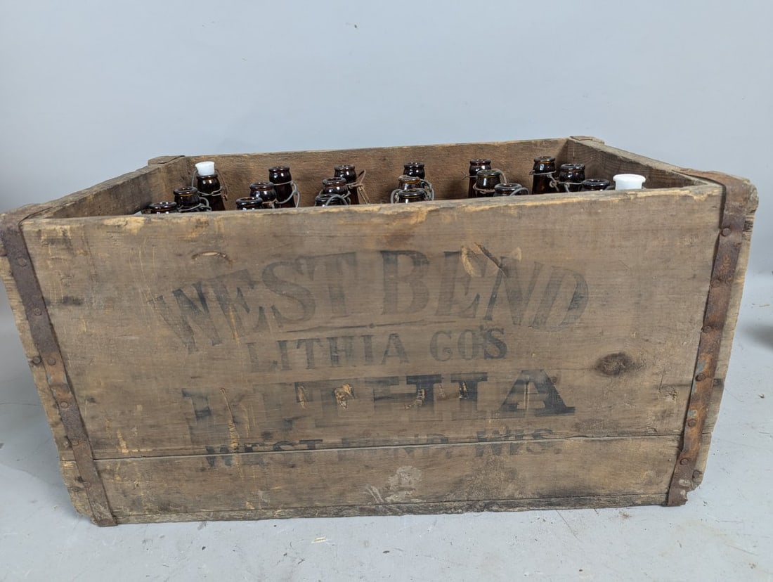 Vintage West Bend Lithia Co Wooden Beer Crate and 24 Amber Bottles Collectible Set: **Important** Please read below description on how to avoid high shipping costs. Don't miss the chance to own this remarkable collectible set featuring a wooden beer crate measuring 12 high x 14 wide