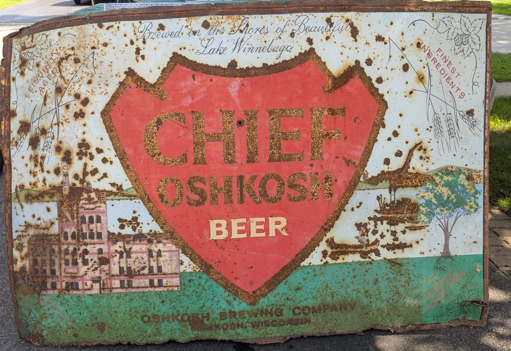 Vintage 1962 Chief Oshkosh Beer Billboard Sign Rare Brewery Decor Advertising Art: **Important** Please read below description on how to avoid high shipping costs. Up for auction is a striking Vintage 1962 Chief Oshkosh Beer Metal Billboard Sign, measuring 46 x 70 x 1 inches. This s