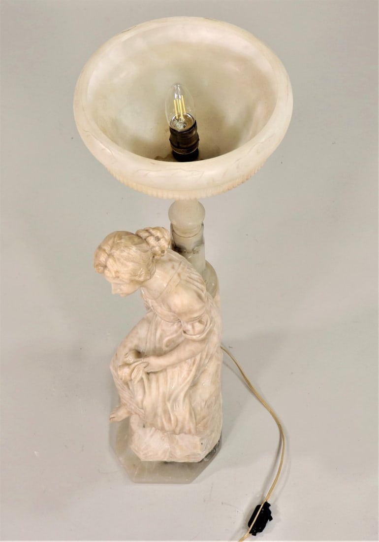 Early 20th Century Carved Alabaster Figural Lamp with Young Lady on Onxy Base: **Important** Please read below description on how to avoid high shipping costs. This Early 20th Century hand-carved alabaster lamp serves as both an art form as well as being a functional light sourc