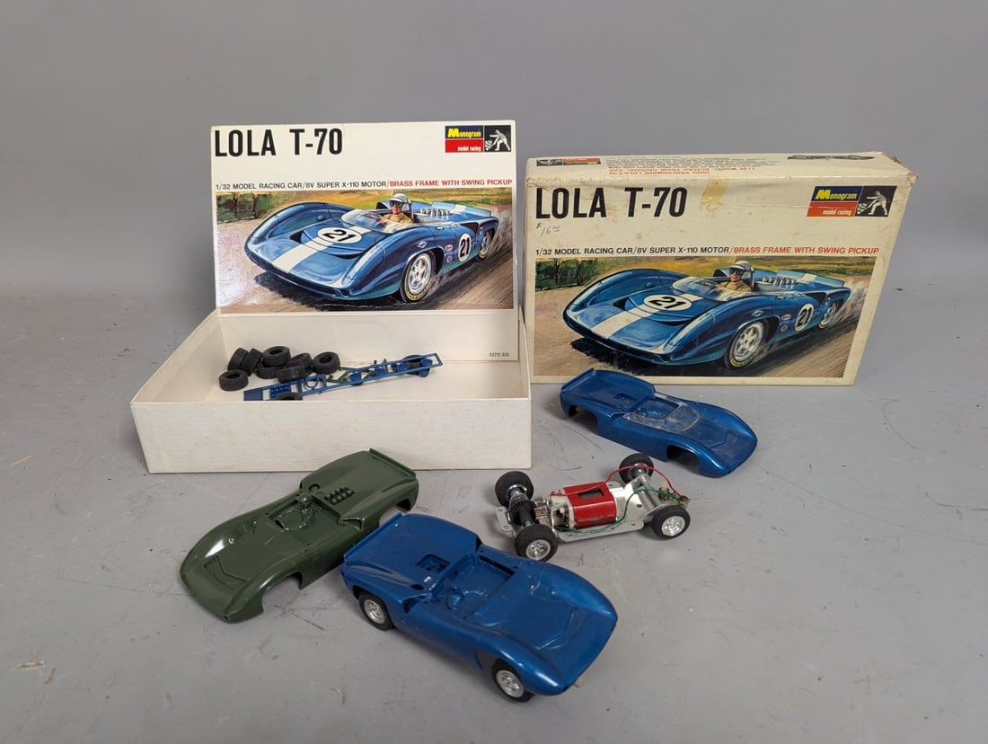 Vintage Monogram Lola T-70 1/32 Scale Slot Car Kits and Parts Lot for Collectors: **Important** Please read below description on how to avoid high shipping costs. Don't miss this mixed lot featuring valuable vintage components from the beloved Monogram Lola T-70 slot car series.