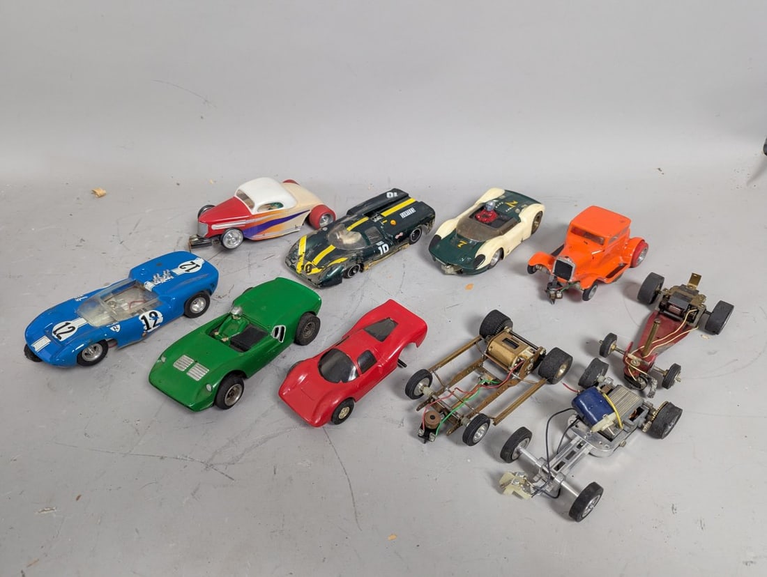Vintage Collection of 1960s 1/24 Scale Slot Cars and Chassis for Restoration: **Important** Please read below description on how to avoid high shipping costs. As found, sold as is. Around 7 x 3 1/2 x 1 1/4 each. This collection features vintage slot cars from the 1960s,
