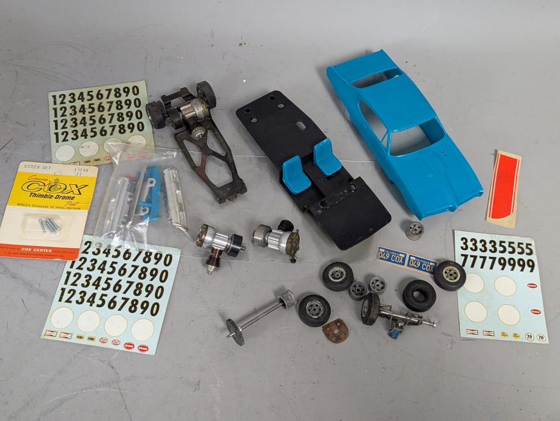 Cox 1968 Pontiac GTO Slot Car Parts Lot with Decals and Spare Components: **Important** Please read below description on how to avoid high shipping costs. This lot features a collection of parts for the classic 7 3/4 x 3 x 2 Cox 1968 GTO slot car. The blue molded plastic