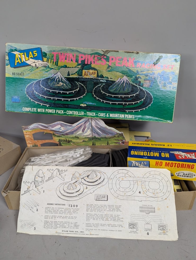 Atlas Twin Pikes Peak HO Scale Racing Set No. 1209 Vintage Parts Restoration Project: **Important** Please read below description on how to avoid high shipping costs. Explore this vintage Atlas Twin Pikes Peak HO Scale Racing Set (No. 1209). Please note, it is incomplete and sold 'as