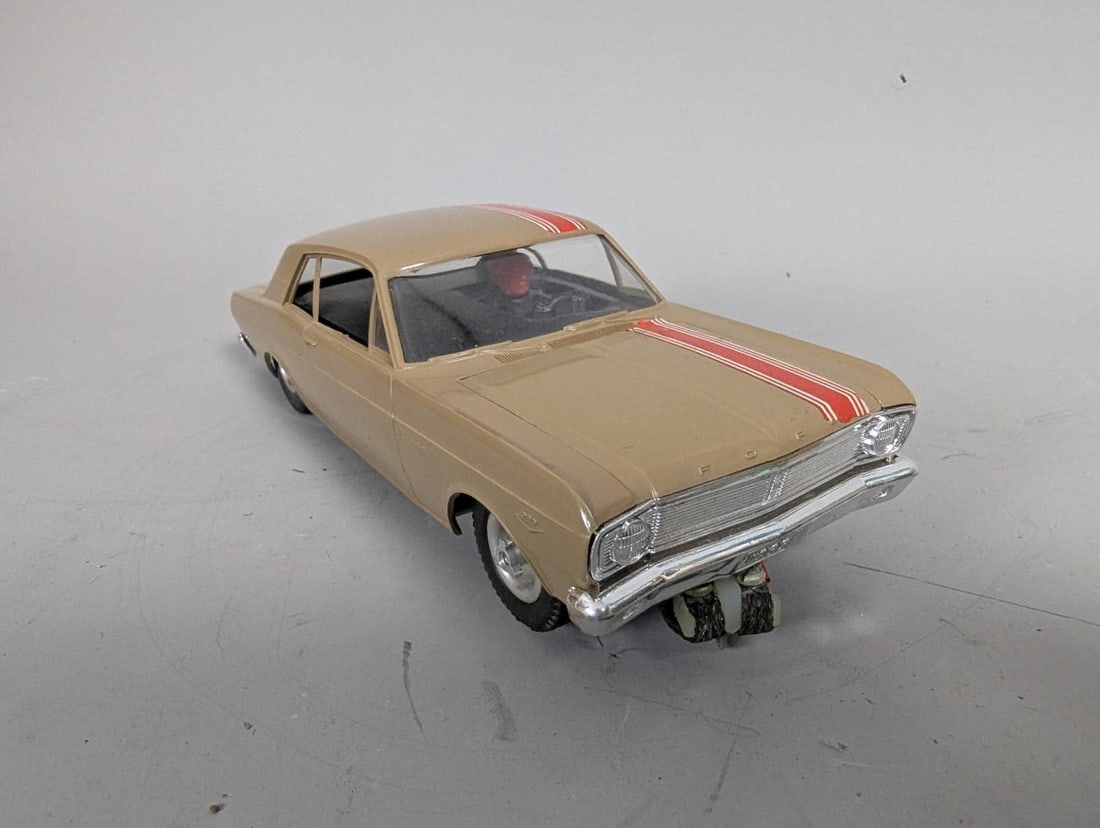 Vintage 1/24 Scale 1966 Ford Falcon Slot Car Custom Chassis Racing Collectible: **Important** Please read below description on how to avoid high shipping costs. Discover this vintage 1/24 scale 1966 Ford Falcon slot car featuring a custom 'scratch-built' aluminum chassis. This
