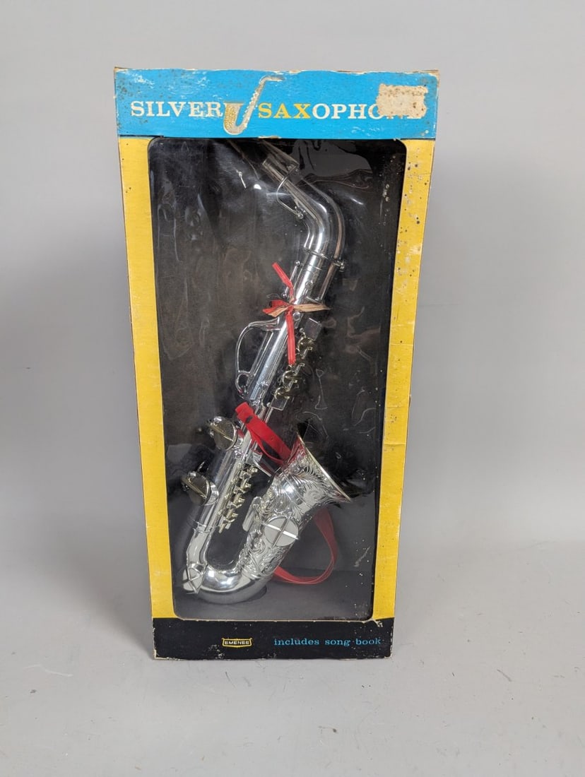 Vintage Emenee Silver Saxophone Toy Musical Instrument in Original Box Collectible: **Important** Please read below description on how to avoid high shipping costs. This Vintage Emenee Silver Saxophone Toy is an exciting find for collectors and enthusiasts alike! Measuring 20 x 9 1/4