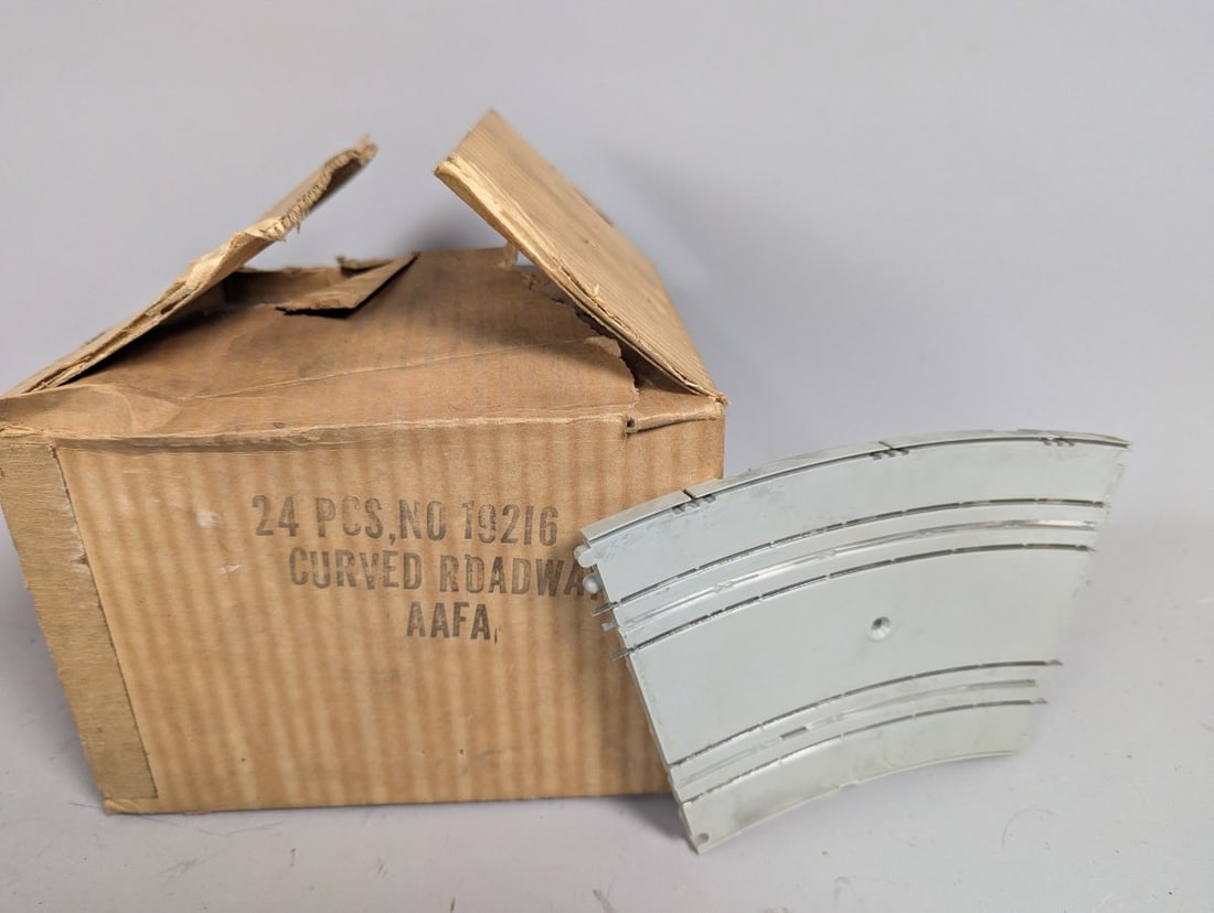 A.C. Gilbert Curved Roadway Slot Car Track Set of 24 NOS Toy Collectibles: **Important** Please read below description on how to avoid high shipping costs. Up for auction is a complete set of 24 A.C. Gilbert No. 19216 Curved Roadway Slot Car Track sections, presented in thei