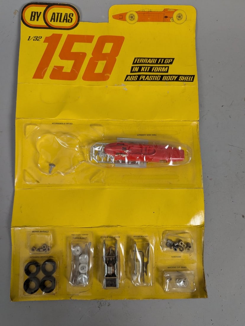 Atlas 1/32 Scale Ferrari 158 F1 GP Slot Car Kit New Old Stock Factory Sealed: **Important** Please read below description on how to avoid high shipping costs. Up for auction is a highly collectible Atlas 1/32 Scale Ferrari 158 F1 GP Slot Car Kit. This new old stock item is