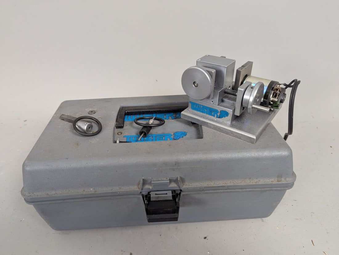 Twister Flute Grinding Jig End Mill Sharpener Tool Set with Branded Case: **Important** Please read below description on how to avoid high shipping costs. This Twister Flute Grinding Jig & End Mill Sharpener Set comes with a gray carrying case measuring 12 x 7 x 5 inches.