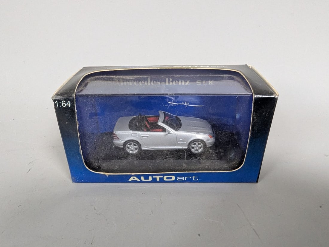 AUTOart 1:64 Mercedes-Benz SLK AMG Roadster Silver Precision Die-Cast Model: **Important** Please read below description on how to avoid high shipping costs. Up for auction is a stunning AUTOart 1:64 model of the Mercedes-Benz SLK AMG Roadster. Measuring at 4 1/4 x 2 x 2 1/4