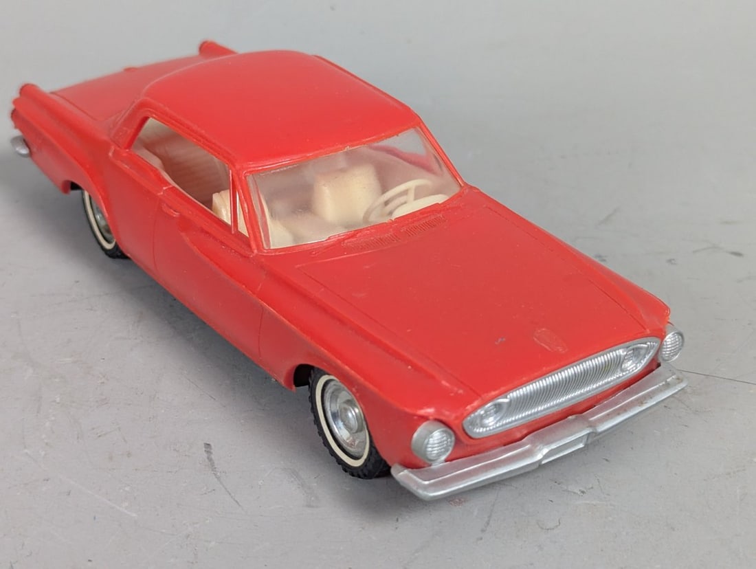 Vintage 1962 Dodge Dart Friction Toy Car No. 603 Classic Collector's Item: **Important** Please read below description on how to avoid high shipping costs. Up for auction is a nostalgic piece of Americana: a Vintage 1962 Dodge Dart Friction Toy Car, measuring 7 x 2 1/2 x 2