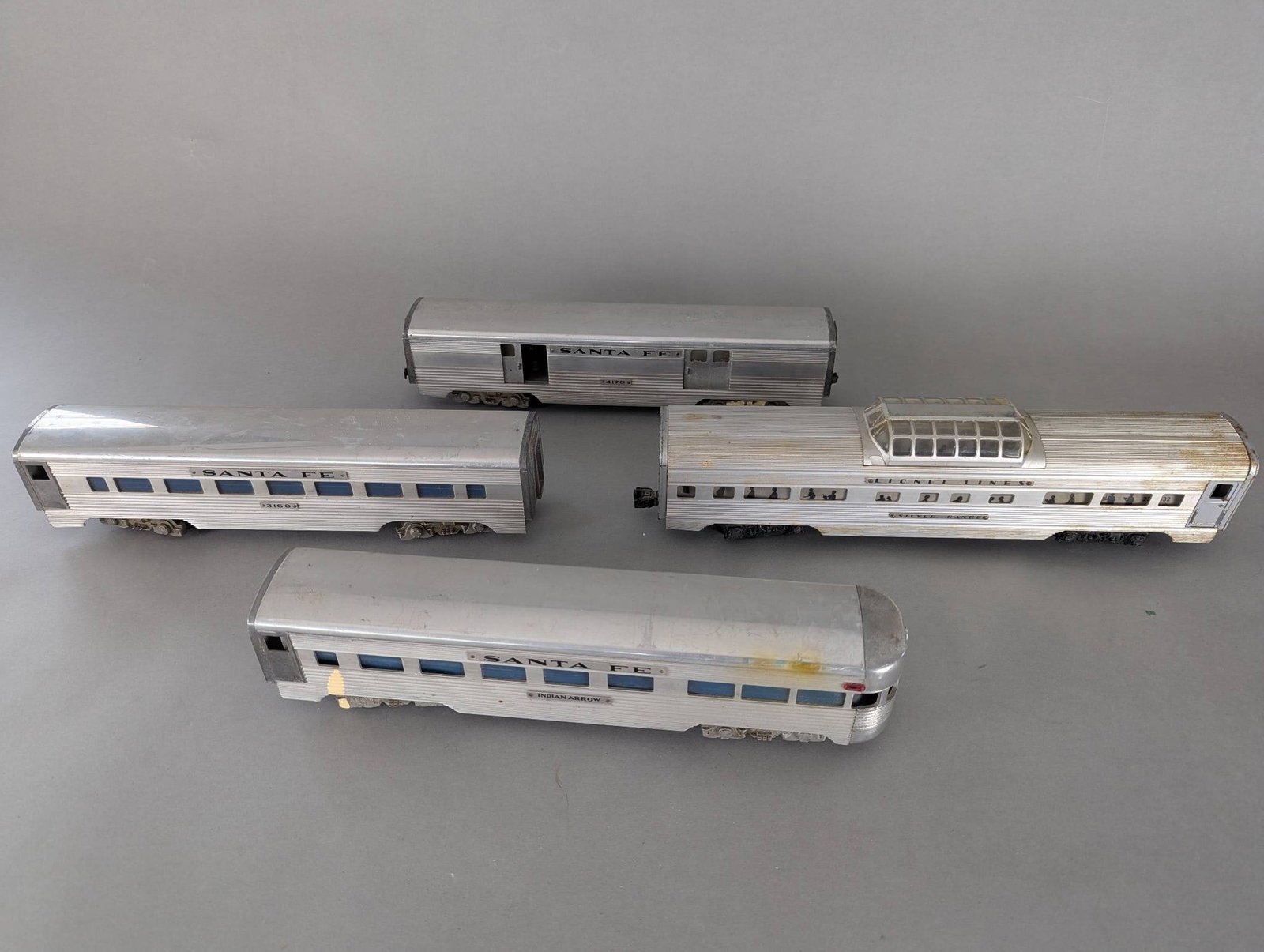 AMT American Model Toys and Lionel Santa Fe Passenger Cars Set: **Important** Please read below description on how to avoid high shipping costs. Set of Santa Fe passenger train cars manufactured by American Model Toys and Lionel Corporation. Includes four aluminum