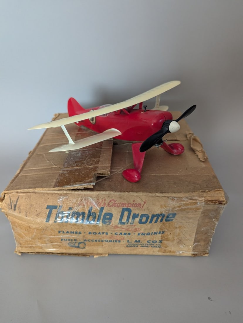 Vintage Cox Thimble Drome PT-19 Trainer Control Line Airplane with Original Box: **Important** Please read below description on how to avoid high shipping costs. Up for auction is a highly collectible Vintage Cox Thimble Drome PT-19 Trainer Control Line Airplane. This classic