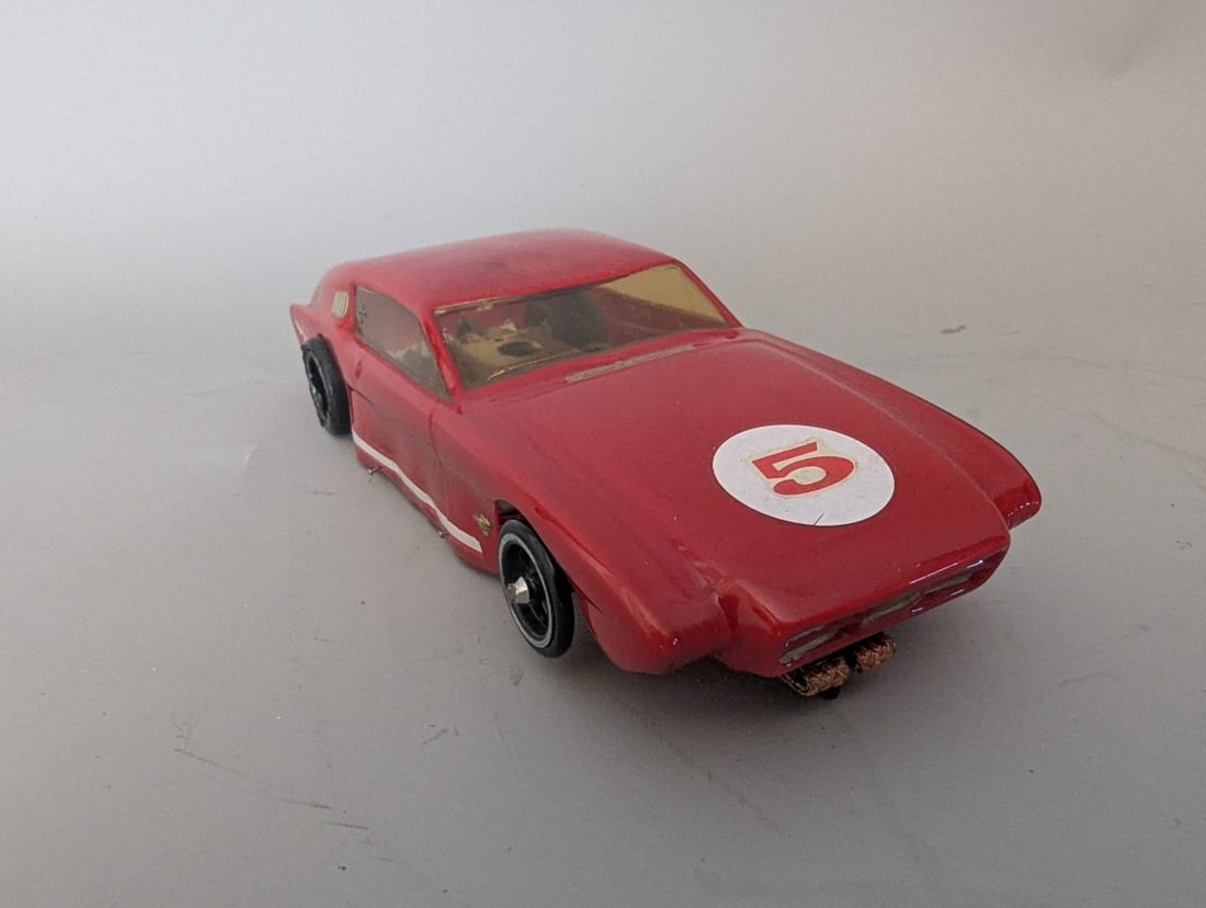 Vintage 1960s Champion of Chamblee 1/24 Scale Slot Car Great Collectible: **Important** Please read below description on how to avoid high shipping costs. This is a 1/24 scale slot car by Champion of Chamblee, measuring 7 1/2 x 3 x 1 1/2. Tested and in working order. The re