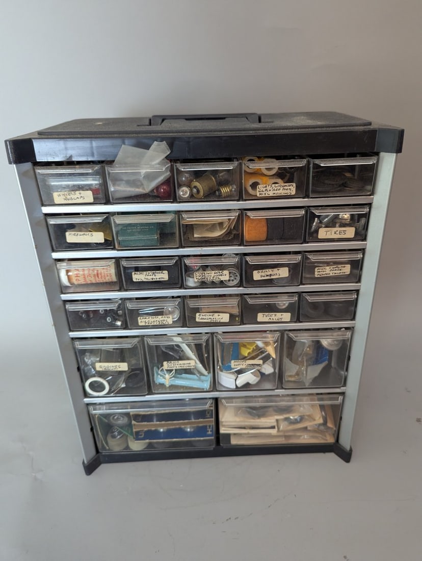 Vintage Slot Car Parts Collection in Multi-Drawer Storage Cabinet by Ulrich and More: **Important** Please read below description on how to avoid high shipping costs. Discover a treasure trove of vintage slot car parts measuring 14 x 12 x 6 1/2. This unique collection features a mix of