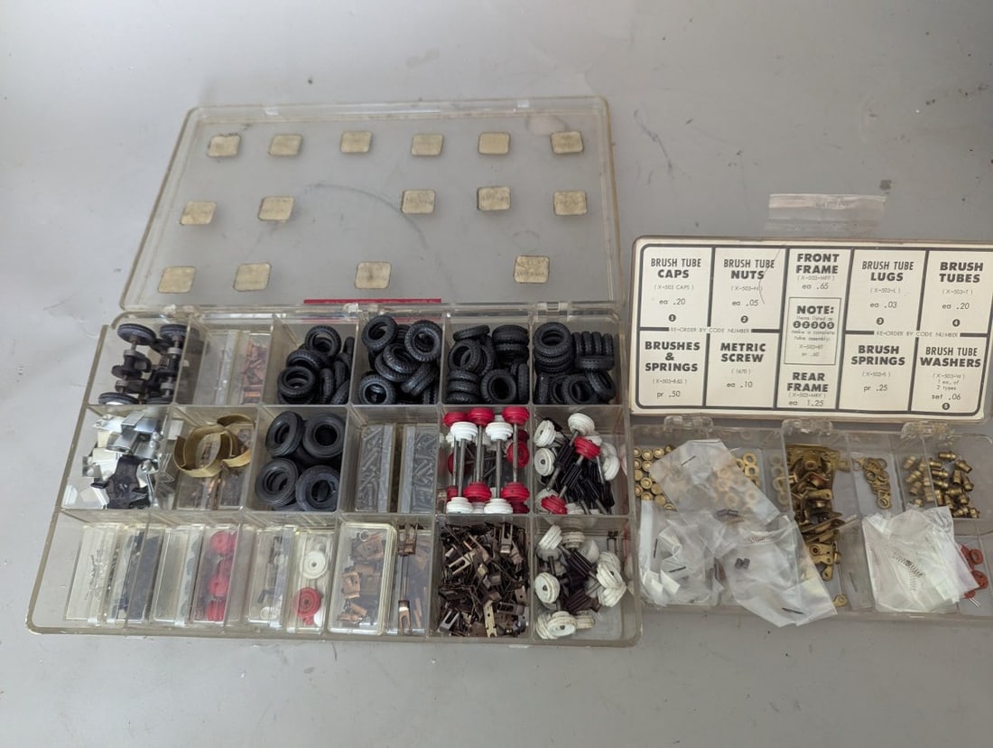 Large Collection Vintage 1960s Cox 1/32 Scale Slot Car Parts in Organizer Boxes: **Important** Please read below description on how to avoid high shipping costs. Discover a remarkable collection of vintage 1/32 scale slot car parts from the iconic Cox Manufacturing Company, a