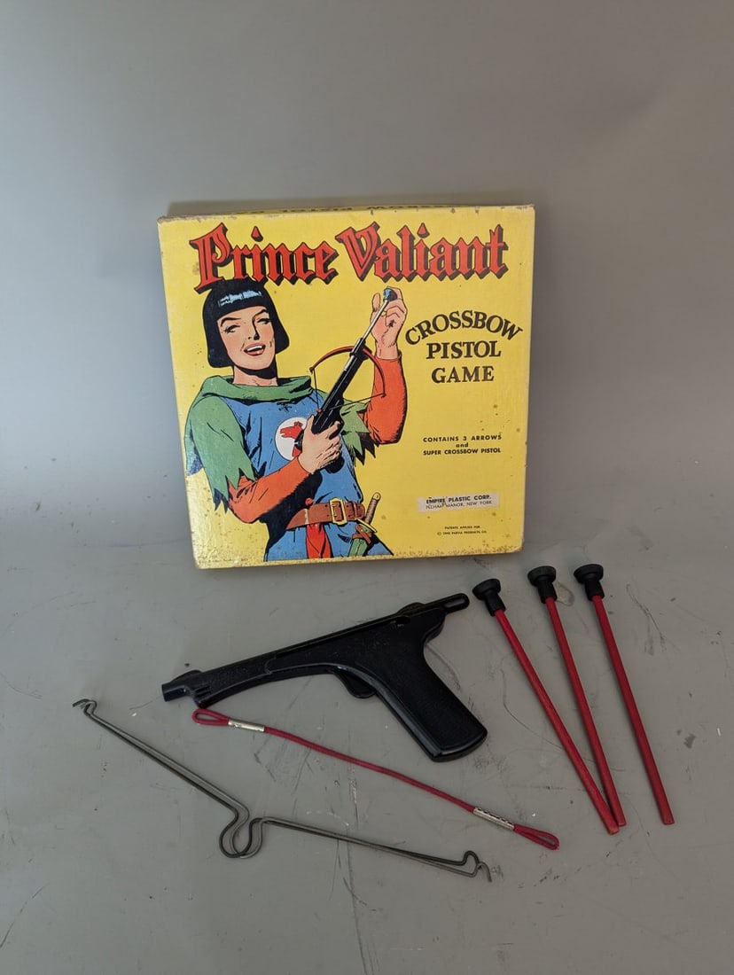 Vintage 1948 Prince Valiant Crossbow Pistol Game by Empire Plastic Corp: **Important** Please read below description on how to avoid high shipping costs. Unlock a piece of toy history with this Vintage 1948 Prince Valiant Crossbow Pistol Game! Box measures 10 x 10 1/2 x 1