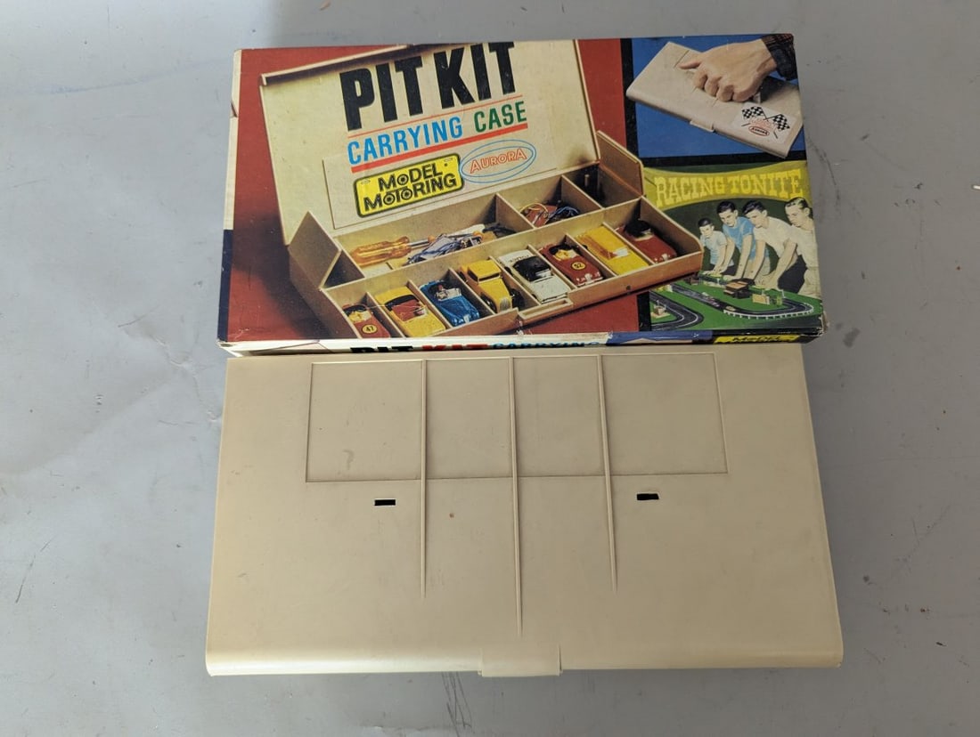 Aurora Model Motoring Pit Kit HO Scale Carrying Case with Assorted Slot Car Parts: **Important** Please read below description on how to avoid high shipping costs. Up for auction is a vintage Aurora Model Motoring Pit Kit carrying case, measuring 11 x 6 x 2 inches. This lot includes