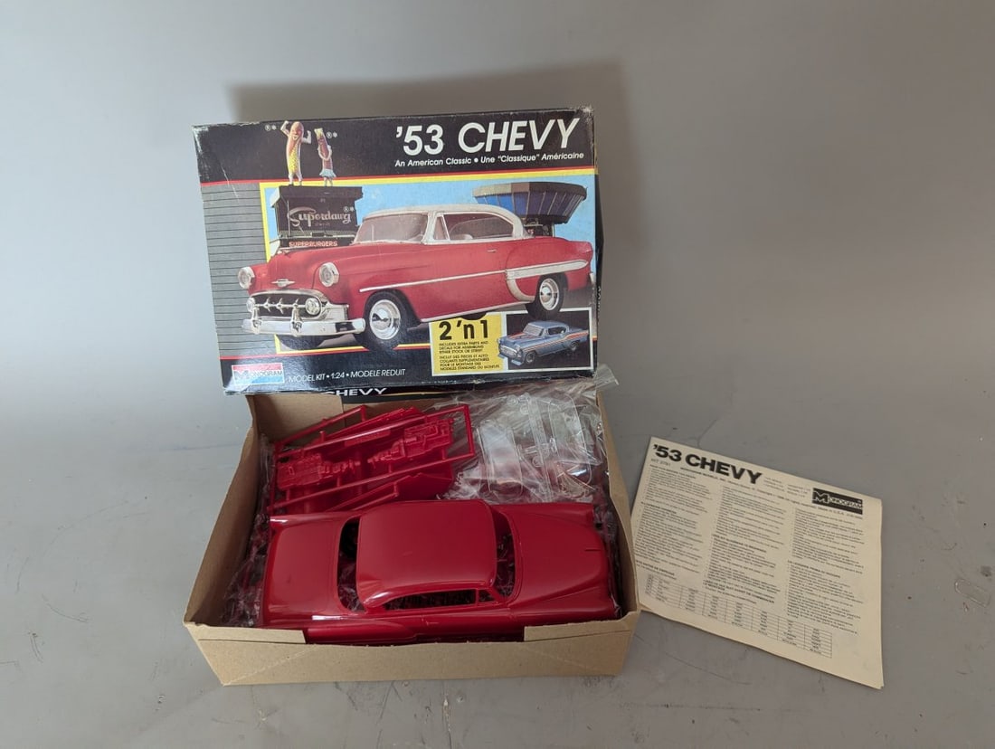 1988 Monogram 1/24 Scale '53 Chevy 2'n'1 Model Kit with Superdawg Box Art: **Important** Please read below description on how to avoid high shipping costs. Immerse yourself in vintage charm with this Monogram 1/24 scale model kit of a 1953 Chevrolet, released in 1988. This N