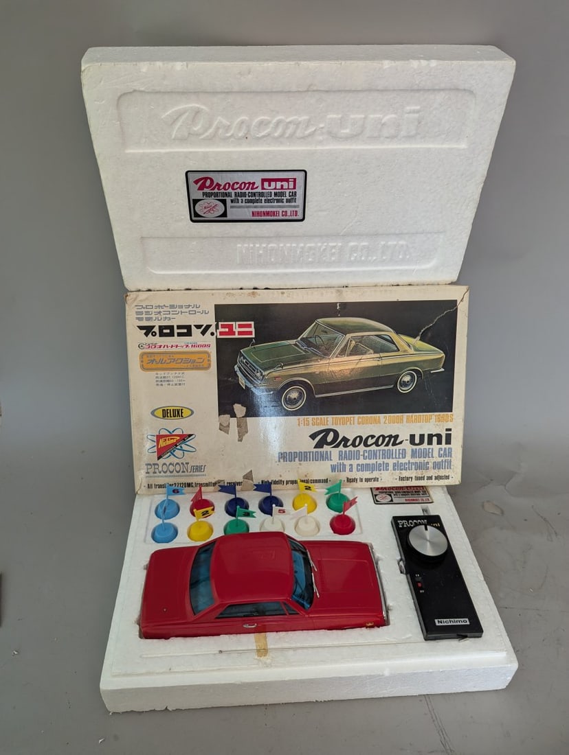 Nichimo Procon-Uni 1:15 Scale Toyopet Corona R/C Car Vintage Japanese Model Collectible: **Important** Please read below description on how to avoid high shipping costs. This is a stunning New Old Stock (NOS) Nichimo Procon-Uni 1:15 Scale Toyopet Corona 2-Door Hardtop 1600S R/C Car. The s
