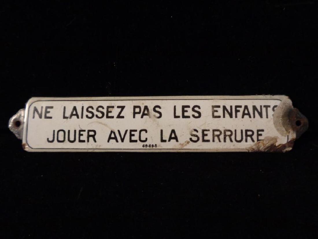 Antique French Porcelain on Metal Sign: "Ne Laissez Pas Les Enfants Jouer Avec La Serrure", Don't Let Children Play with the Lock. Some damage and loss to porcelain to right side. 8" L x 1.5" H
