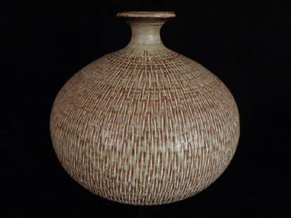 Ira Bates Large Studio Art Pottery Vase: Large size vase with incised carved sides in natural tone multi-colored drip glazes. Ira Bates signature to bottom. 11.5" H x 12" dia. approx.