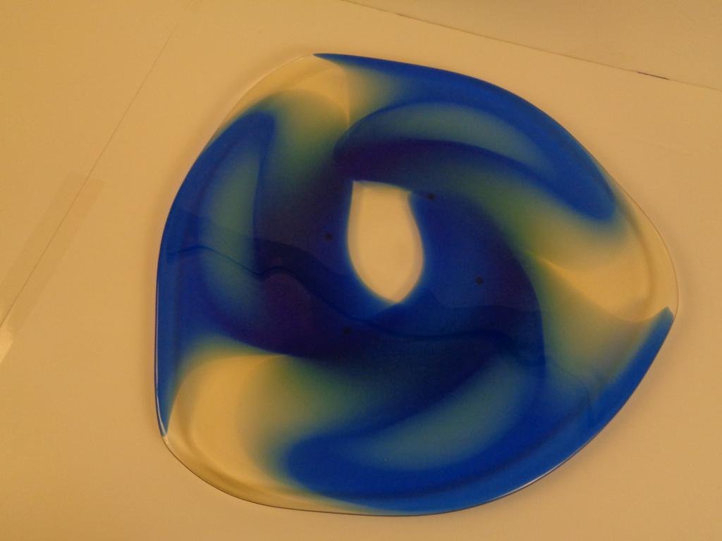 Ulrica Hydman-Vallien Unique Platter for Kosta Boda: Large triangular form glass platter in slightly amber tinted clear glass with large cobalt blue swirls. Hand etched to bottom "8UHVUN 997004", "KOSTA BODA", and "Ulrica HV" signature. Hydman-Vallien (
