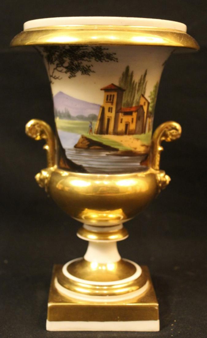 Antique Empire Style Porcelain Urn: Continental white porcelain with bright gold details. Each side with hand painted views of Italian style villas. Two piece with original bolt and wing nut screw attachment. No apparent marks. Some fle