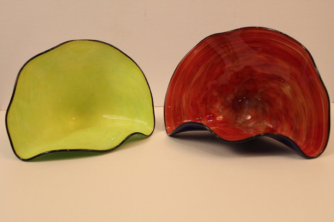Two David Smith Art Glass Free Form Shells: (1) Cobalt blue mottled glass with red interior, dated 4/04. 5" H x 7" W approx. (2) Green mottled glass with chartreuse interior, dated 11/04. 4.75" H x 6.5" W approx. Both with etched signatures.