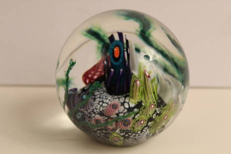Mark Eckstrand Coral Sealife Glass Paperweight: Millefiori coral reef design. Approximately 20 various sized impact "dings" (pin point to .25" dia) in various depths. Etched ME with 94 date to bottom. 4.25" dia. approx.
