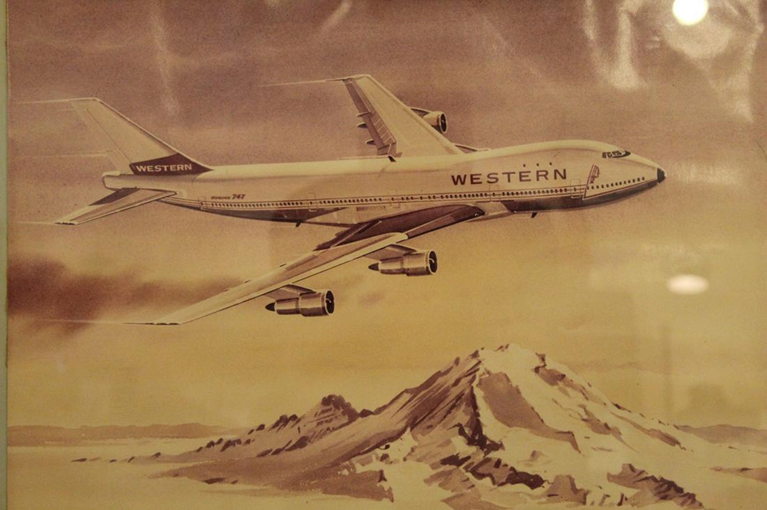 Vintage Western Airlines Boeing 747 Print: Western Airlines advertising print for the Boeing 747. Printed John W. MacDonald signature. Mounted to mat board. Maple frame. Circa 1960's/ 70's. 16" x 20" print; 23" x 29" frame.