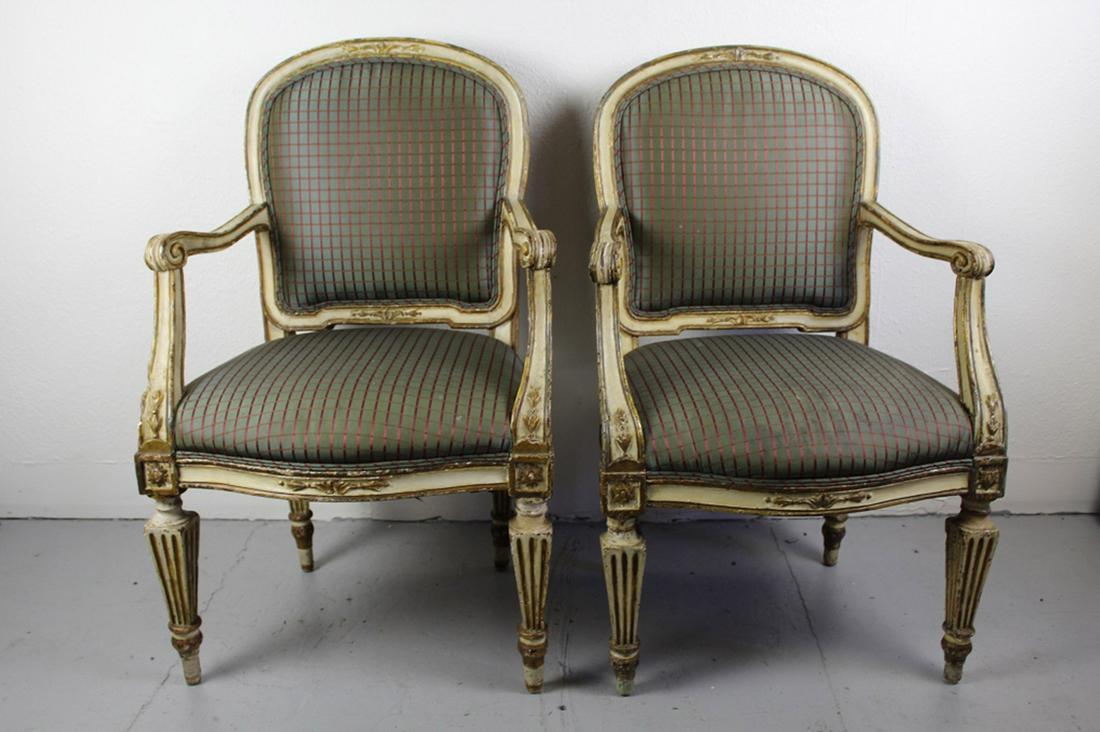 Pair Antique Italian Neoclassical Arm Chairs: Hand carved walnut frames with peg construction and old parcel gilt finish. Silk fabric with some spotting, etc. Circa early 19th C. 39.5" H x 25" W x 22" D approx.
