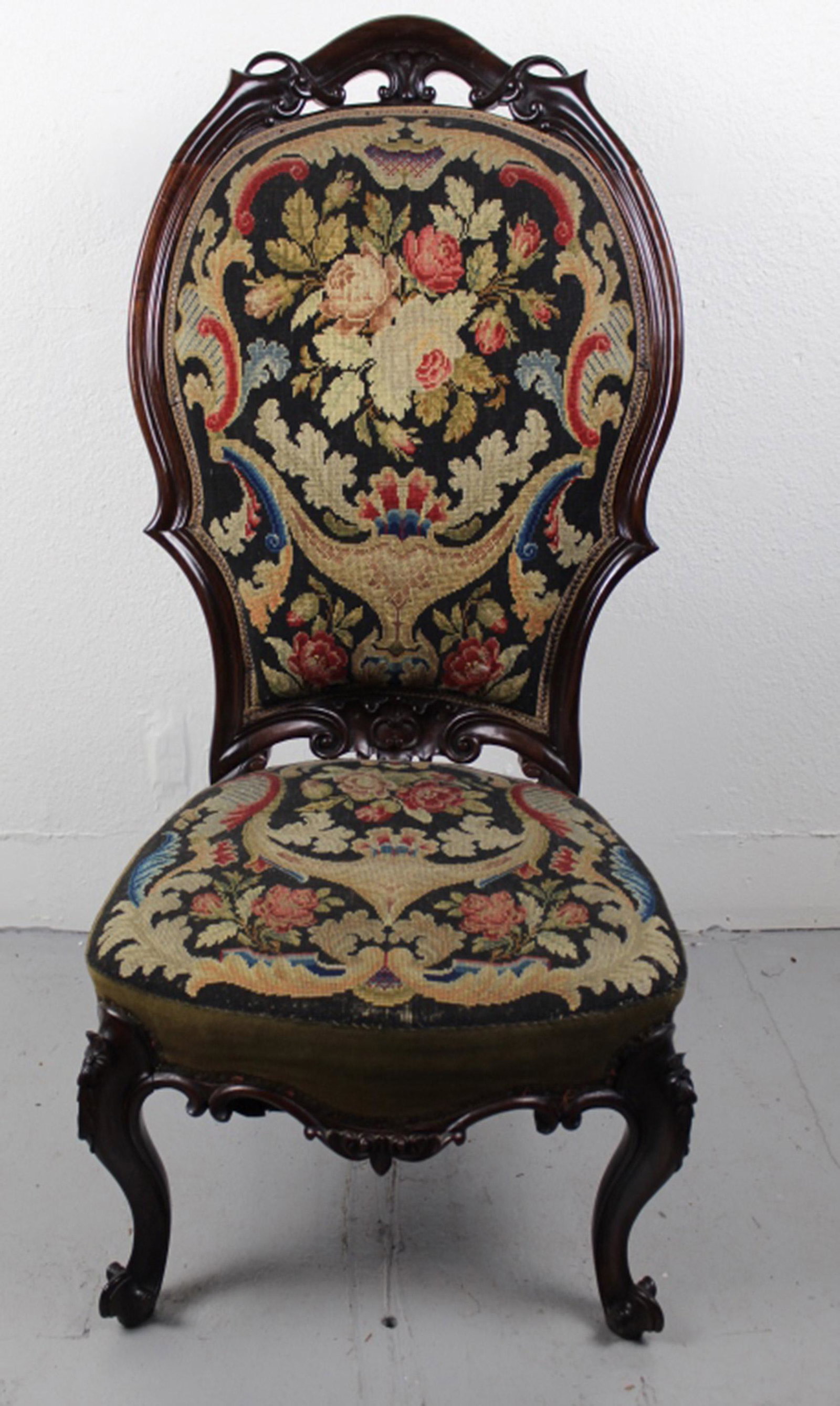 Antique Victotian Belter Style Rosewood Chair: Ladies parlor side chair with hand carved solid rosewood frame (beech seat rails). Possible original needle point and velvet fabric. Later added support board below seat webbing. Very good condition. 