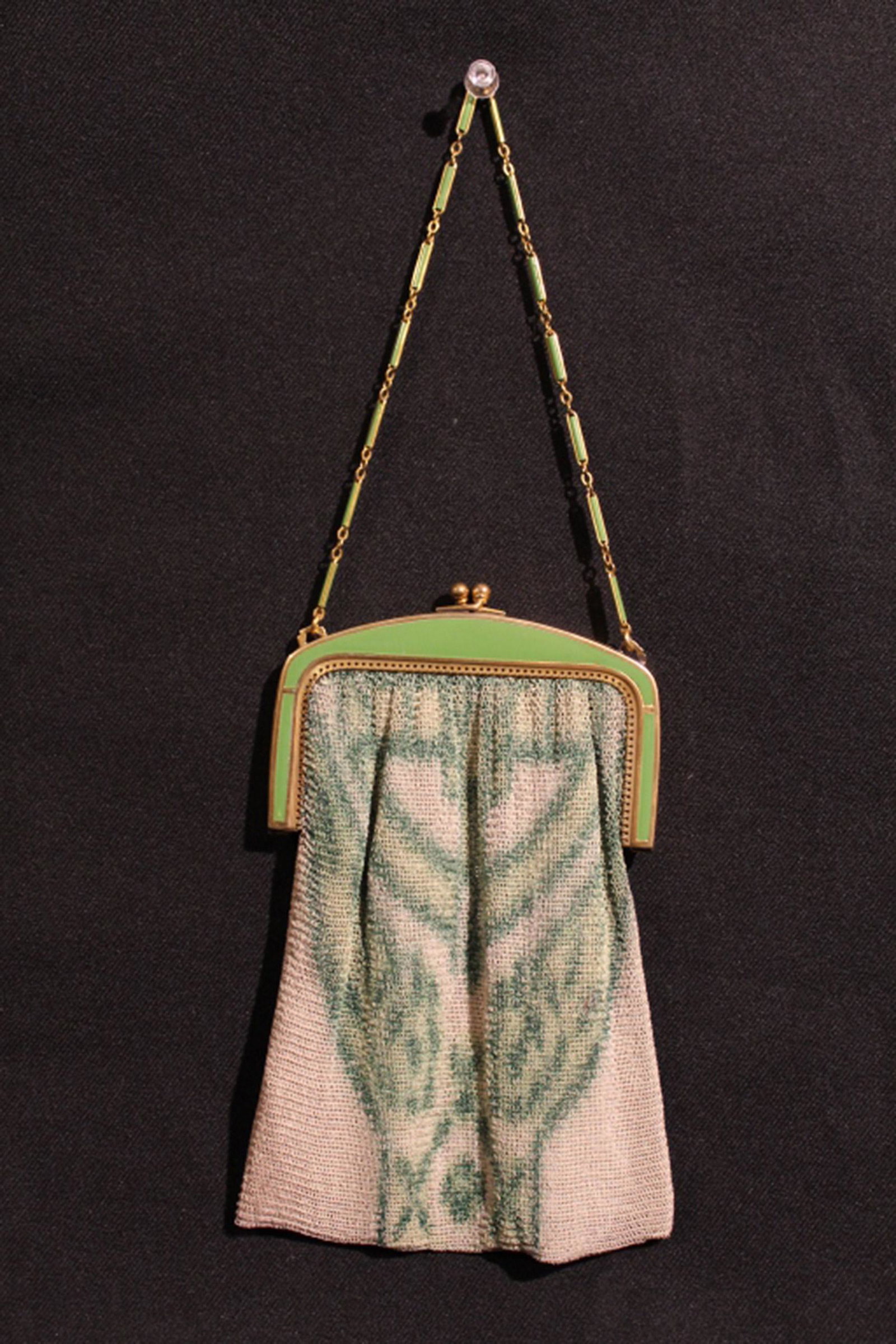 Antique Whiting Davis Art Deco Mesh Purse: Brass clasp with green enamel (some minor flaking) and link chain. Chain mesh purse with air brushed painted design and green silk interior (excellent condition). Whiting Davis raised mark. 4" W x 7" 