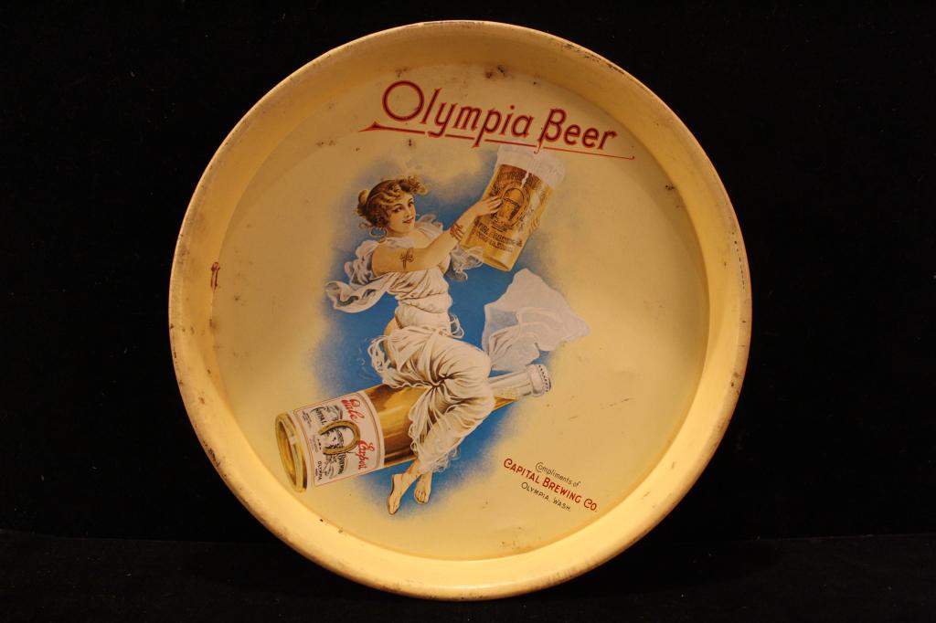 Olympia Beer Capital Brewing Co Tin Tray: Olympia Beer Compliments of Capital Brewing advertising tin drink tray. In fair codition scratches and areas of lifted paint; paint loss to edges. Possibly a 1960's 70's reproduction. Dimension 13" di
