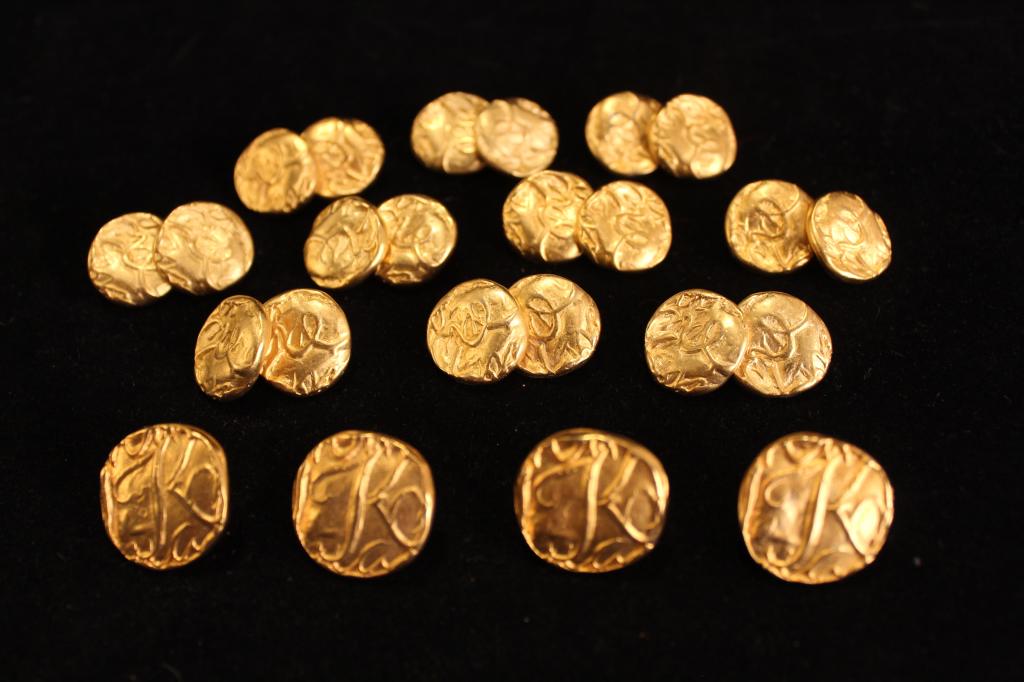 Donna Karan - Robert Lee Morris Cuff Links & Pins: Cast gold tone metal in brutalist / modernist design with raised logos and words. Five pair cuff links attached with chain, 3/4" dia. approx. Four lapel pins, 7/8" dia. approx. All marked DK Co. Circa