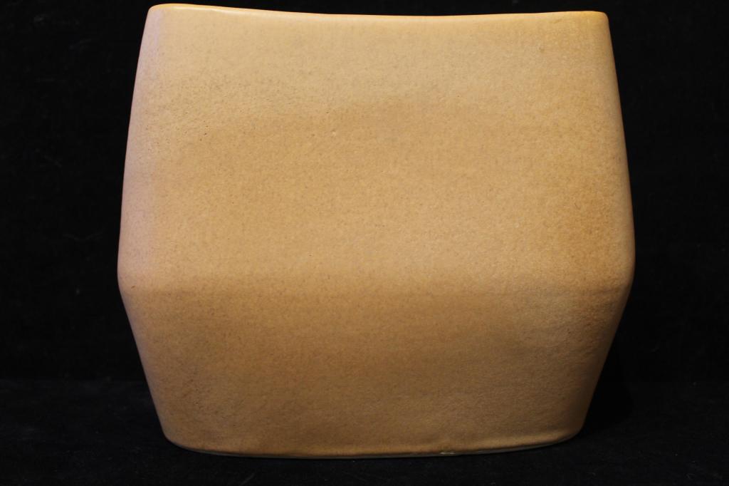 Russel Wright Bauer Pottery Pillow Vase: Impressed Russel Wright Bauer mark to bottom. Matte apricot speckled glaze. Excellent condition; 2 pin point factory glaze flaws to one side. Circa 1940's. 8.5" H x 10" W.