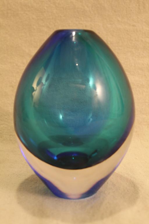 Orrefors Sven Palmqvist Glass Vase: Clear glass over a blue and green interior. Etched Orrefors signature to base and original Orrefors Sweden label to side. Excellent condition. 6" H.
