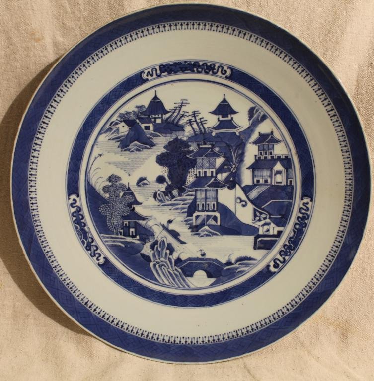 Chinese Porcelain Canton Ware Blue Willow Charger: 19th Century finely painted Chinese porelain Canton ware charger in the "Blue Willow" pattern with bamboo patter on the reverse. In good condition with rough, unglazed areas along the edge and spur ma