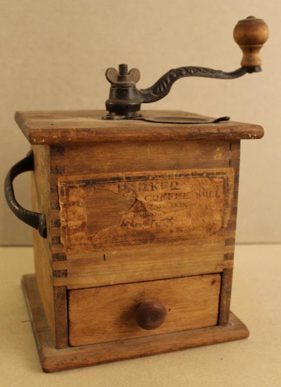 Antique Parker No. 555 Hand Crank Coffee Mill: Vintage Parker No. 555 hand crank coffee mill. In good working condition with some loss to paper label on front. Dimension 6 1/2"W x 6 1/2"D x 7"H.