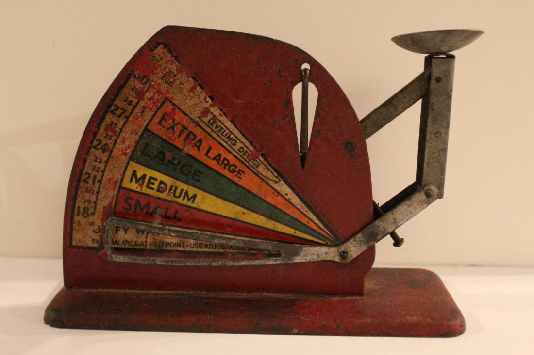 Vintage Red Metal "Jiffy Way" Egg Scale: "Jiffy Way" vintage metal egg scale. In fair condtion: crackling and flaking to decal and some loss of surface paint; overall corrosion to surface. Dimension 3" W x 8"L x 5 1/2"H.