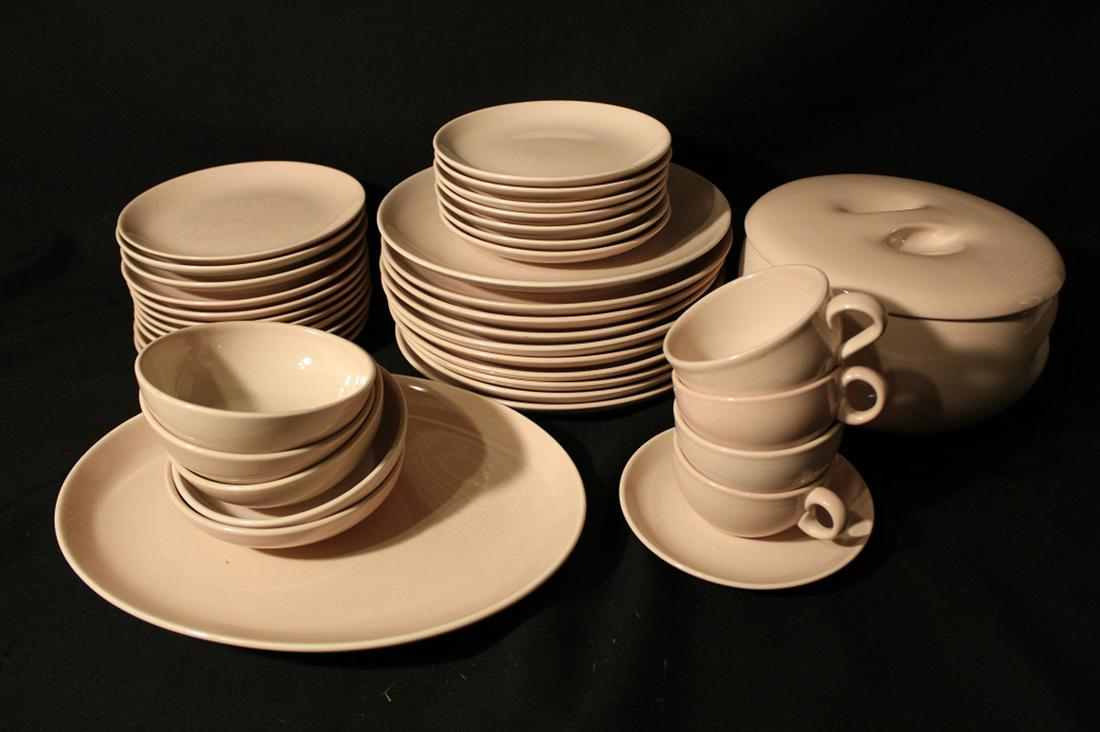 Russel Wright Iroquois Casual Pink: Good condition with various signs of use. Includes 10 dinner plates, 11 salad plates, 7 bread plates, 2 low bowls, 3 bowls, 1 large serving bowl with lid, 1 oval platter, 4 cups, 1 saucer.